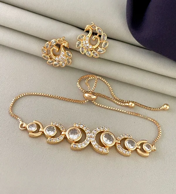 https://d1311wbk6unapo.cloudfront.net/NushopCatalogue/tr:f-webp,w-600,fo-auto/18K_Gold_Plated_Adjustable_Braclet_and_Ring__47MRHO5S52_2023-03-18_1.JPG__NAVKAR
