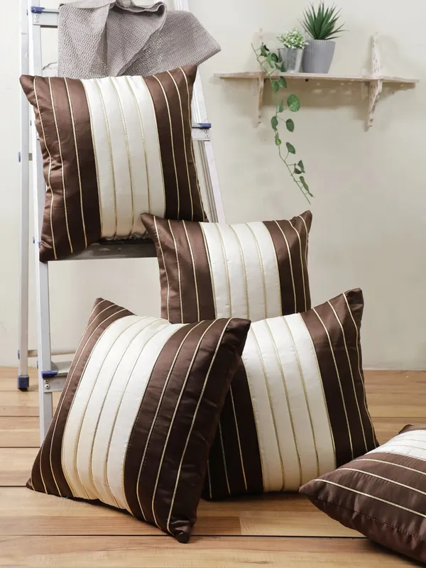 https://d1311wbk6unapo.cloudfront.net/NushopCatalogue/tr:f-webp,w-600,fo-auto/Gifts_Island®_Set_of_5_Brown___Cream_Polyester_Silk_Gold-Tone_Striped_Square_Cushion_Covers_16_inch_x_16_inch__40.64_x_40.64_cm__Brown__4RF7HE4JVT_2022-08-22_1.jpg__Gifts Island