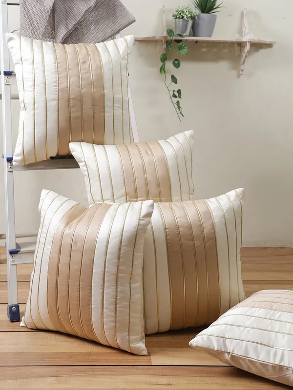 https://d1311wbk6unapo.cloudfront.net/NushopCatalogue/tr:f-webp,w-600,fo-auto/Gifts_Island®_Set_of_5_Cream___Beige_Polyester_Silk_Gold-Tone_Striped_Square_Cushion_Covers_16_inch_x_16_inch__40.64_x_40.64_cm__Cream__CC6WNX63LW_2022-08-22_1.jpg__Gifts Island